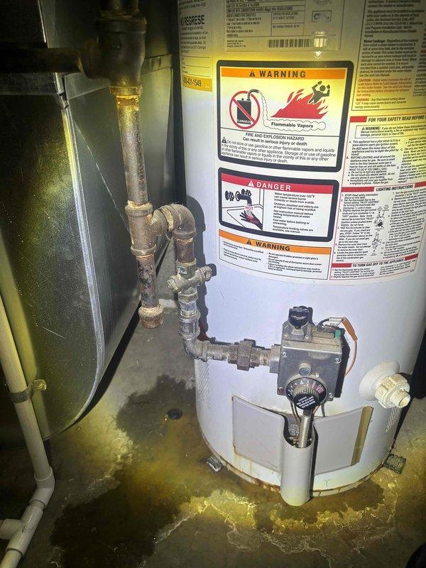 Conducted on-site assessment of leaking 40-gallon residential water heater located in basement utility area. Inspected existing unit, noting active water leakage evidenced by concrete floor staining and moisture accumulation around base of tank. Evaluated current installation configuration including copper and galvanized supply lines, gas control valve assembly, pressure relief valve, and associated plumbing connections showing age-related corrosion and mineral deposits. Documented existing equipment specifications, venting requirements, and spatial constraints for replacement planning. Photographed current installation setup including pipe routing, connection points, and surrounding mechanical systems to develop accurate replacement estimate. Provided comprehensive quote for complete water heater replacement including removal and disposal of failed unit.