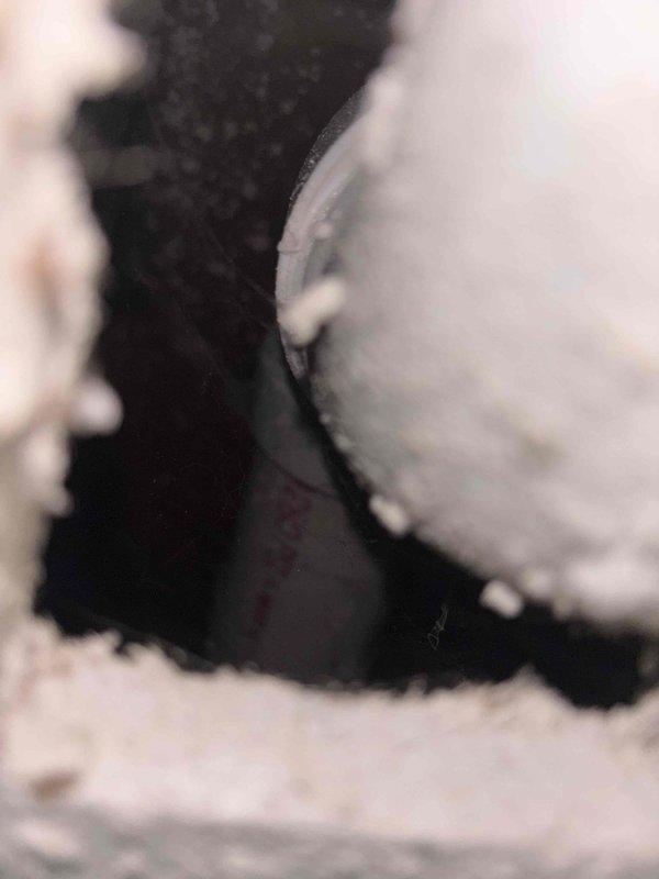 Responded to multiple drainage issues including an upstairs toilet with incomplete flushing and backup problems in the main floor bathroom sink and toilet. Performed main plumbing stack cleanout by snaking the drain line to remove blockages causing the drainage restrictions throughout the vertical waste system. Successfully cleared obstructions and restored proper flow to all affected fixtures, resolving the interconnected backup issues in both levels of the residence.