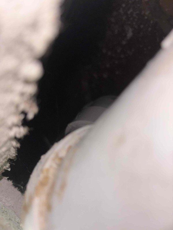 Responded to multiple drainage issues including an upstairs toilet with incomplete flushing and backup problems in the main floor bathroom sink and toilet. Performed main plumbing stack cleanout by snaking the drain line to remove blockages causing the drainage restrictions throughout the vertical waste system. Successfully cleared obstructions and restored proper flow to all affected fixtures, resolving the interconnected backup issues in both levels of the residence.