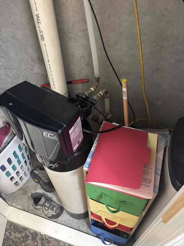 Completed routine plumbing maintenance inspection of residential water system including EcoWater softener unit, associated PVC and copper supply lines with shut-off valves, and kitchen sink drainage assembly. All components were visually inspected and photographed, with plumbing fixtures, P-trap configuration, and water treatment system found to be in proper working order with no leaks or deficiencies observed.