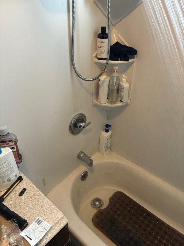 Responded to recall for shower valve cartridge that had fallen out along with retaining pin. Arrived with replacement pin, reinstalled cartridge assembly, and secured with new retaining clip to restore proper shower valve operation. Tested system to verify proper hot and cold water control and confirmed no leaks.