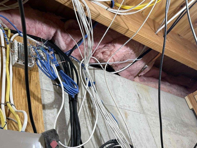 Responded to service call for tanked water heater with reported crust formation at top of unit, water pooling, and improper flue venting. Upon inspection in basement, confirmed mineral deposit buildup on top of water heater and evidence of condensation issues related to compromised venting system. Assessed flue pipe configuration and determined improper draft was causing combustion gases to condense, leading to corrosion and water accumulation. Performed diagnostic evaluation of venting components and water heater operation. Addressed drainage concerns and documented existing conditions showing water staining on floor around unit. Completed necessary repairs to restore proper venting function and resolve moisture infiltration issues.