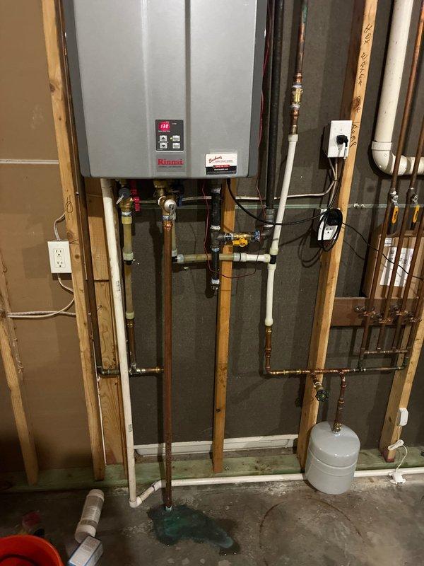 Performed routine plumbing maintenance on a Rinnai tankless water heater system, including inspection of all water supply lines, copper piping connections, and PEX/PVC plumbing components. Cleaned and inspected the system's inlet filter screen, which showed no debris accumulation, and verified proper operation of the expansion tank and associated pressure relief valves.