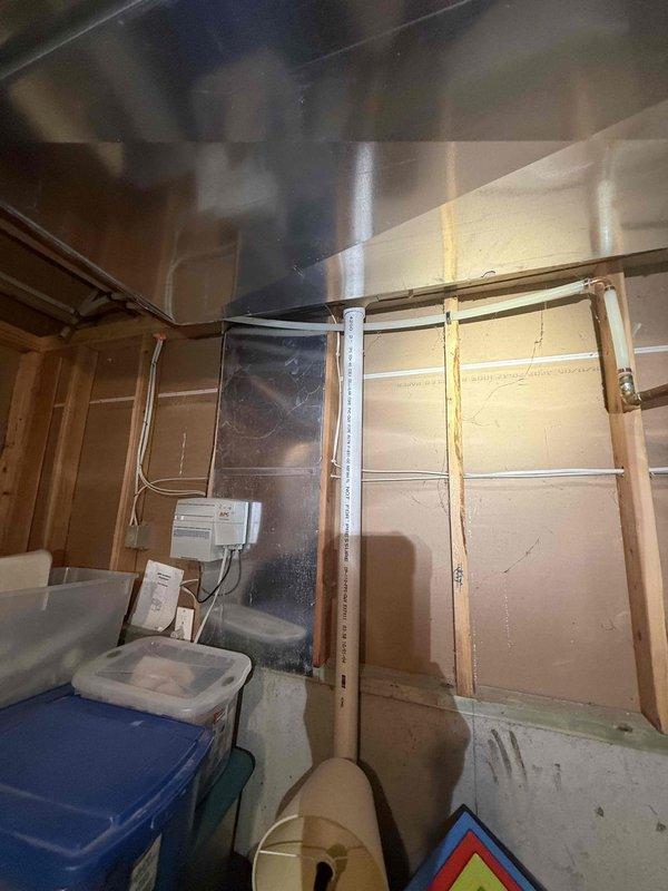 Completed preventive plumbing maintenance inspection in basement utility area. Inspected exposed plumbing lines, including copper piping and gas lines running along ceiling joists and wall framing. Verified proper support and routing of all visible water supply and drain lines in unfinished space. Checked for signs of leaks, corrosion, or deterioration on accessible piping systems. Confirmed clearances around HVAC ductwork and electrical panel to ensure no interference with plumbing infrastructure. All plumbing components found in satisfactory operating condition with no immediate repairs required.