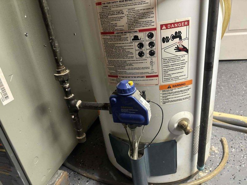 Performed comprehensive maintenance service on residential tanked water heater, including complete tank flush to remove sediment buildup and extend equipment lifespan. Inspected all plumbing connections, pressure relief valve, and heating elements for proper operation. Verified water pressure readings at outdoor spigot connection point and confirmed all safety labels and warning indicators were clearly visible and intact on unit.