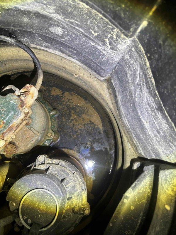 Responded to service call for sump pump activating but immediately shutting off. Upon inspection, found existing sump pump system in unfinished basement with corroded pump motor showing significant age-related deterioration, rust spots, and surface oxidation. Diagnosed pump failure due to worn motor components preventing proper operation cycle. Performed system evaluation of basin, discharge piping, and electrical connections. Replaced failed sump pump unit with new assembly, ensuring proper float switch operation and motor function. Tested system through multiple activation cycles to verify continuous operation and proper water discharge through existing PVC piping. Confirmed electrical connections secure and system operational.