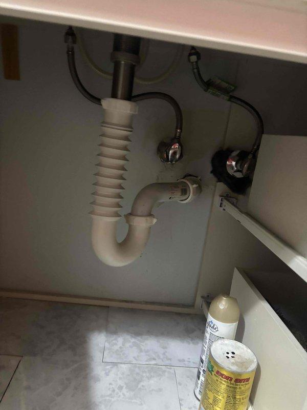 Responded to a clogged drain call at a basement bathroom sink in a split level home. Upon arrival, assessed the vanity-mounted sink with undermount basin and confirmed blockage in the drain line. Removed obstruction from the P-trap assembly beneath the sink, verified proper water flow through the drain system, and tested all plumbing connections for leaks. System restored to full functionality with water draining freely through the fixture.