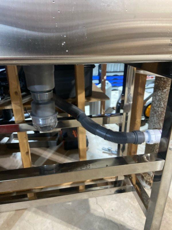 Completed comprehensive plumbing renovation including removal of existing three-handle tub/shower valve and installation of customer-supplied single-handle valve with raised shower head height. Main water supply was shut off to facilitate valve replacement, with all rough-in work prepared for drywall and tile installation. Trim kit installation scheduled for follow-up visit after tile work completion.

Installed customer-supplied utility sink with complete drain line reconfiguration to achieve proper alignment. Tapped into existing hot and cold water lines above sink location, running new supply lines down wall with individual shut-off valves. Connected sink drain assembly and faucet supply lines, completing full leak testing.

Replaced frost-free outside hose bib and installed new 1/2-inch ball valve in basement to allow isolated shut-off of exterior fixture without interrupting whole-house water supply. Installed two quarter-turn angle stops for kitchen and bathroom sink faucets.

Co