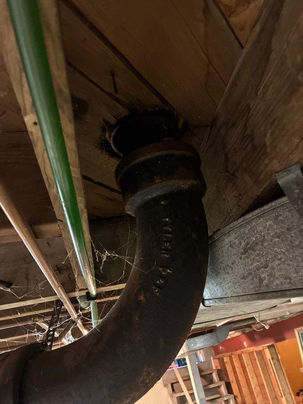 Completed main line horizontal drain line replacement in basement area. Removed deteriorated drainage piping and installed new PVC drainage system with proper pitch and connections to existing plumbing infrastructure. Work included securing new piping to floor joists with appropriate hangers and ensuring all joints were properly sealed for code compliance.