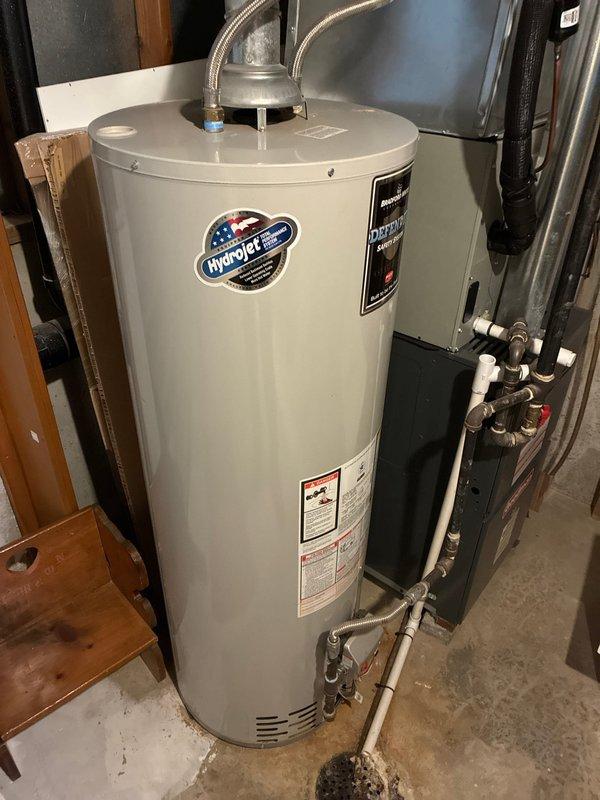 Performed scheduled maintenance on HydroJet tanked water heater located in basement utility area. Conducted comprehensive inspection of unit including water connections, pressure relief valve, and drainage system. Verified proper operation of all components and documented current condition of installation with photographic records.