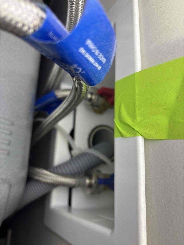 Completed plumbing maintenance visit inspecting toilet tank water supply connection and appliance water line connections. Verified proper installation of braided stainless steel flexible supply lines, checked gasket seals at toilet tank fill valve, and examined multiple appliance water connections with shutoff valves in utility area. All components found in good working condition with no leaks detected. Tankless water heater system confirmed as part of ongoing maintenance membership coverage.