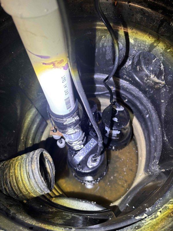 Successfully installed customer-supplied sump pump system in basement sump basin. Mounted pump unit with appropriate PVC discharge piping, including shutoff valves for maintenance access, and secured all electrical connections. System tested and verified operational, with proper water level activation and discharge flow through newly installed piping configuration.