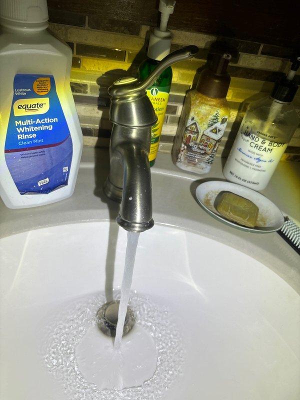 Responded to a same-day plumbing service call to address water flow and fixture operation concerns. Inspected bathroom sink faucet assembly and verified proper water flow and drainage function. During comprehensive system evaluation, identified frost accumulation on brass valve fitting and associated piping in mechanical space, indicating potential temperature differential or insulation issue requiring monitoring. Documented conditions with photographic evidence for service records. All plumbing fixtures operating within normal parameters at time of inspection.