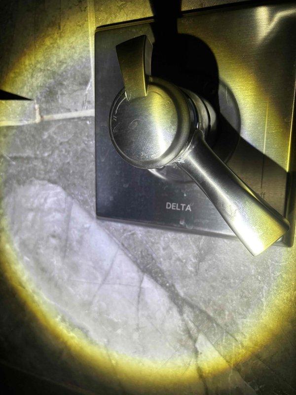 Completed routine plumbing maintenance including water softener service and salt replenishment. Inspected bathroom plumbing fixtures, including Delta brand faucets in brushed nickel and oil-rubbed bronze finishes, verified proper operation of sink drains and handles, and confirmed all fixtures were functioning correctly with no leaks detected.