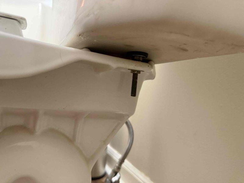 Responded to guest bathroom toilet issue with reported backing up and continuous running. Upon inspection, identified faulty flapper valve and fill valve assembly causing constant water flow into tank. Removed tank lid and examined internal flush mechanism components. Replaced worn flapper and adjusted fill valve to proper water level. Tested flush cycle multiple times to ensure proper operation and verified no continuous running. Confirmed toilet bowl drainage functioning correctly with no backup issues. Additionally, adjusted water heater temperature setting on lower level unit per request to increase hot water output temperature.