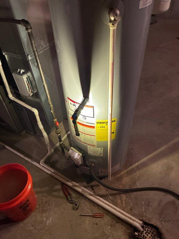 # Plumbing Preventive Maintenance Completed

Performed comprehensive plumbing preventive maintenance on residential water heater and associated systems. Inspected water heater tank condition, verified proper operation of temperature and pressure relief valve, checked all copper supply and discharge piping connections for leaks or corrosion, and examined expansion tank mounting and pressure settings. Evaluated PVC drain line configuration, tested electronic control unit functionality, and confirmed proper venting arrangements. Assessed overall system performance including sediment accumulation indicators and burner operation. All plumbing components found operating within normal parameters with no immediate repairs required at this time.