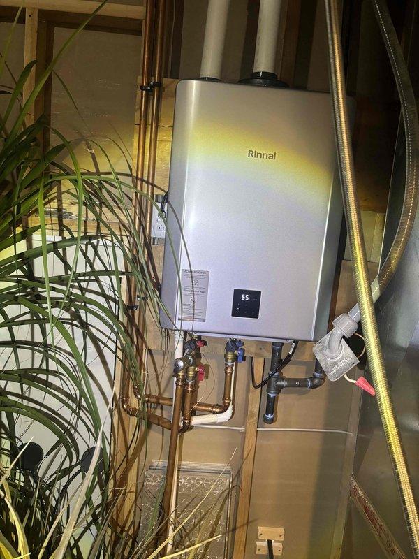 Performed preventative maintenance on Rinnai tankless water heater system, completing a comprehensive tankless flush procedure to remove mineral buildup and maintain optimal efficiency. Inspected all copper piping connections, brass valves, and hot/cold water control assemblies, confirming proper operation and no visible leaks. All components functioning within normal parameters upon completion.