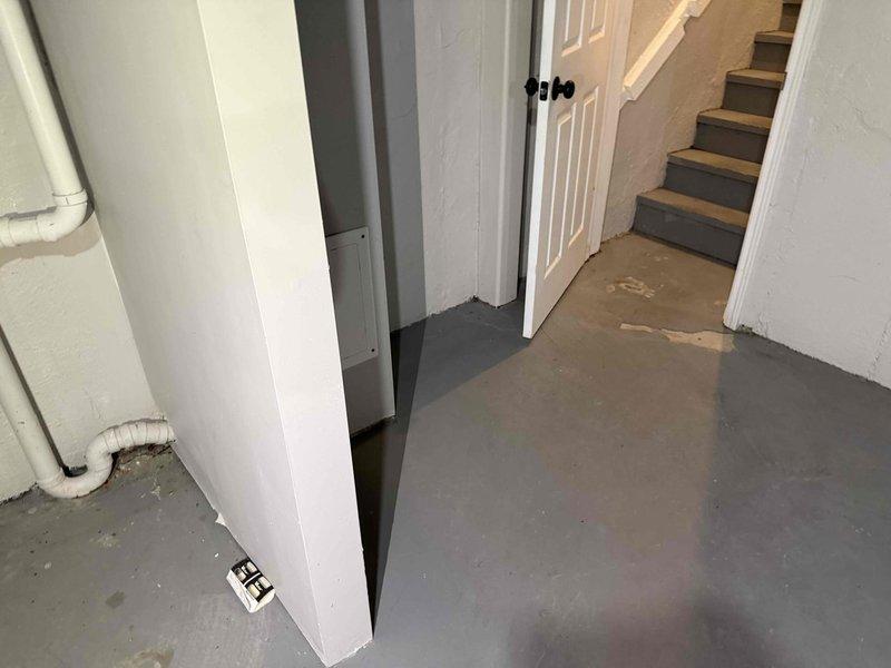 Conducted on-site assessment of basement area for sump pump and French drain installation. Evaluated existing drainage conditions, identified optimal pump placement location near basement corner with visible floor moisture indicators, and determined routing path for discharge piping. Inspected exterior yard drainage patterns and grading to establish French drain configuration along property perimeter for improved water management and foundation protection.