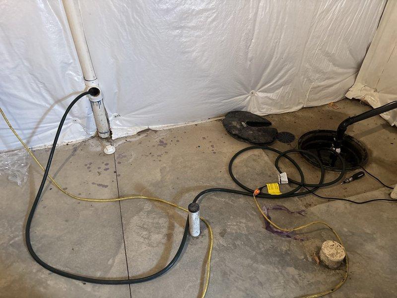 Responded to service call for non-functioning sump pump in basement. Upon arrival, inspected existing sump pump system and determined unit had failed and required replacement. Removed old sump pump from pit and installed new replacement pump unit. Connected discharge piping to existing PVC drainage system and verified proper electrical connections. Tested new pump operation to ensure proper activation and water discharge functionality. System restored to full working order with pump cycling correctly and effectively removing water from basin.