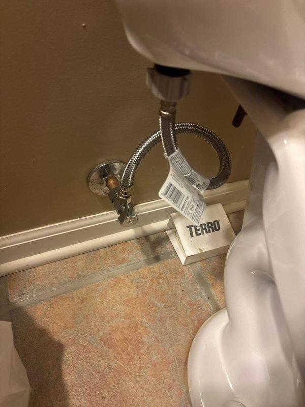 Completed comprehensive plumbing inspection of residential property. Examined bathroom toilet installation, verifying proper water supply line connections, shut-off valve operation, and braided metal supply line integrity. Inspected kitchen plumbing system including double-basin composite sink, pull-down faucet assembly, drain functionality, and water flow performance. All fixtures photographed and documented for reference.
