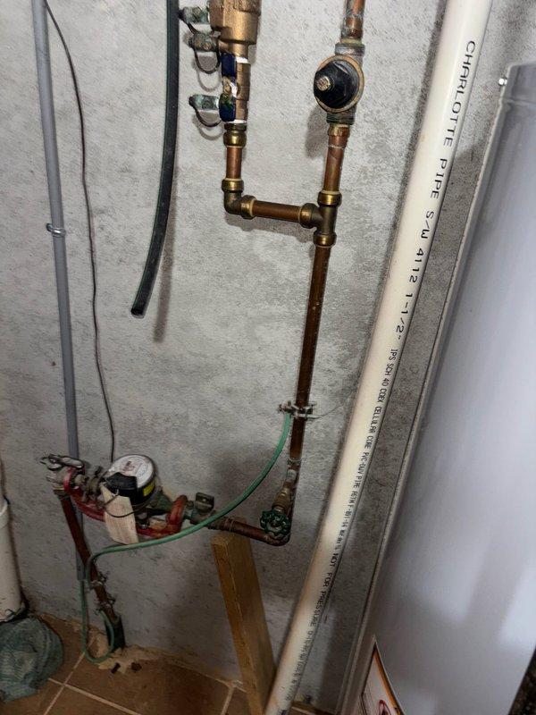 Responded to service call for leaking water heater and successfully completed same-day installation of 50-gallon gas water heater. Removed failed unit, installed replacement with proper copper supply line connections, pressure relief valve, expansion tank, shutoff valves, and code-compliant venting using PVC piping, restoring hot water service to the property.