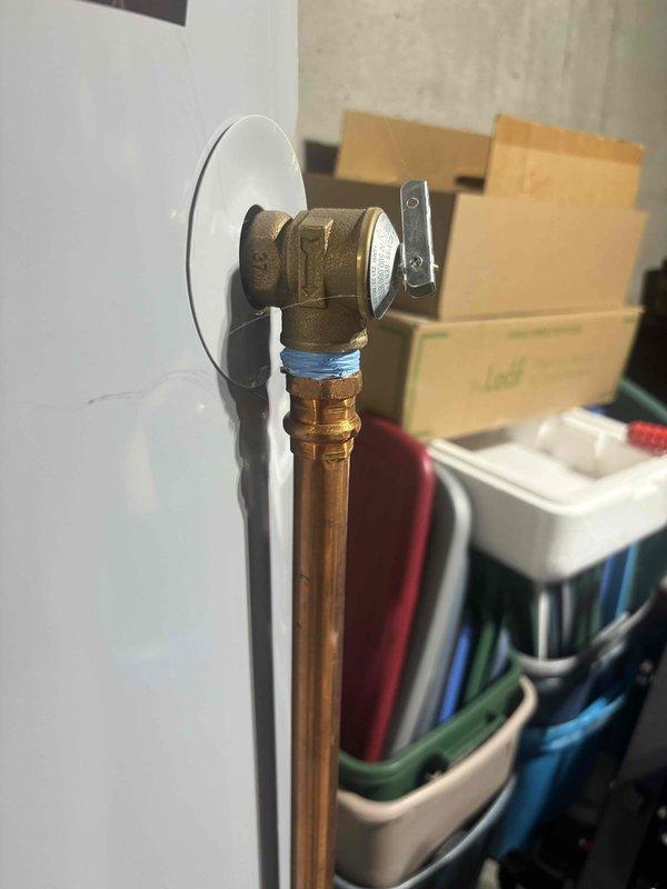 Responded to reported water heater leak in basement. Upon inspection, found State brand tanked water heater with active leak requiring replacement. Removed old leaking unit and installed new State water heater with proper copper supply line connections and brass fittings. Installed blue expansion tank on hot water outlet line to protect system from thermal expansion. Applied thread seal tape to all threaded connections to ensure leak-free operation. Secured all copper piping with appropriate supports and verified proper clearances. Tested system for leaks, confirmed adequate water pressure, and ensured proper temperature settings. All connections sealed and operational upon completion.