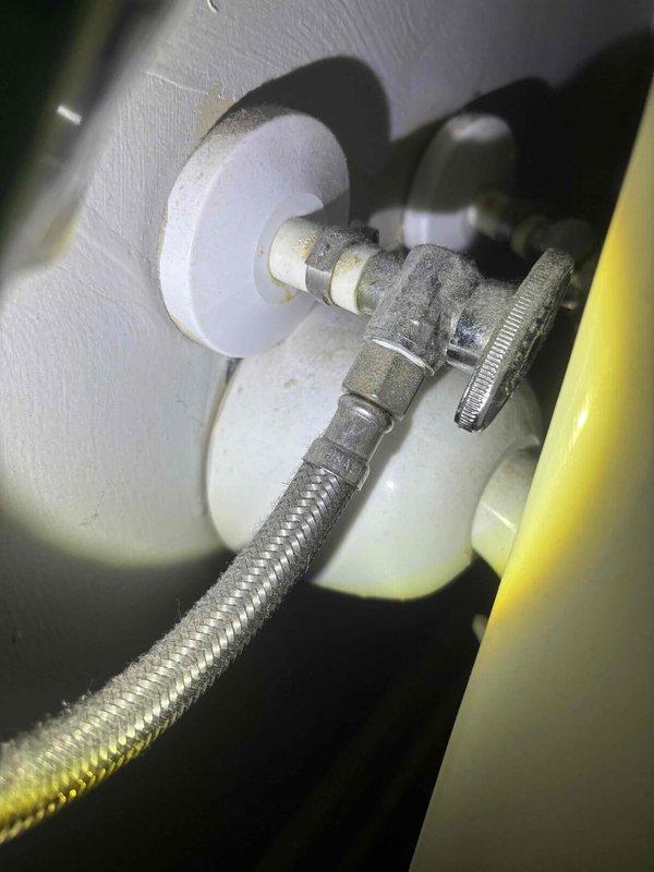 Completed preventive plumbing maintenance inspection on residential bathroom fixtures. Tested shower head water flow and spray pattern, confirming proper operation with adequate pressure distribution across all nozzles. Inspected water supply connection assembly, including shut-off valve, braided stainless steel supply line, and wall-mounted escutcheon plate for secure mounting and absence of leaks. All fixtures functioning properly with no deficiencies noted.