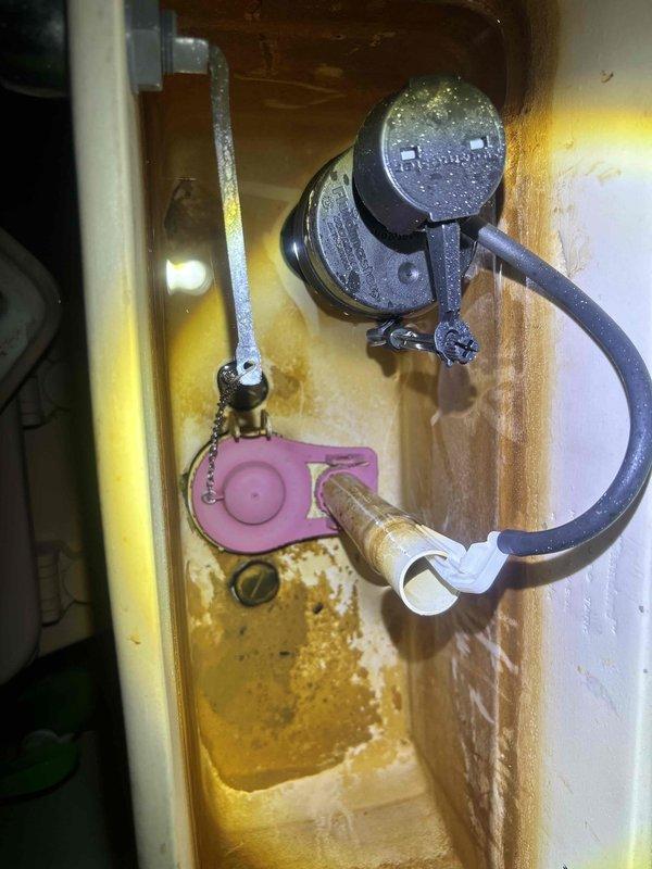 Completed preventive plumbing maintenance inspection of residential water heater and sump pump system. Inspected water heater tank, copper supply lines, pressure relief valve, and associated plumbing connections for proper operation and signs of wear. Examined sump pump assembly including motor, float switch mechanism, and discharge system; noted existing mineral buildup and staining consistent with normal operation but requiring future monitoring.