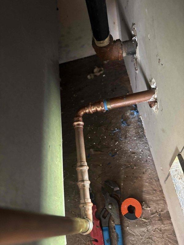 Responded to a main line repair for a failed hose bib supply line. Upon inspection, discovered the copper pipe connection to the exterior hose bib had separated, causing a complete line failure. Removed the damaged section of copper piping, fabricated new connections with proper fittings and soldered joints, and restored water supply to the hose bib. System tested and verified leak-free operation upon completion.