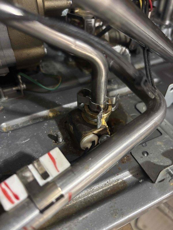 Technician responded to address water heater leaking and water softener malfunction. Performed comprehensive repair on tankless water heater unit, replacing all deteriorated O-rings at connection points and leak-affected components. Installed new temperature and pressure relief valve with mounting bracket to ensure proper safety operation. 

Upon inspection of the Puronics water softener system, hardness reagent testing revealed complete failure of the softening process, with water immediately turning dark blue indicating no treatment was occurring. Performed carbon media swap-out on the softener unit to restore proper water conditioning functionality. Removed front access panel of tankless unit to access internal heat exchanger, gas valve assembly, and plumbing connections. Verified all pipe connections, including copper and PVC inlet/outlet lines, were properly sealed following O-ring replacement. Tested igniter assemblies and flame sensors for proper operation. Confirmed all electri