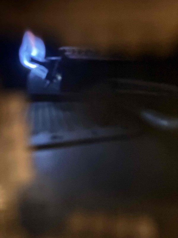 Responded to service call for gas water heater with pilot light that would not stay lit. Upon arrival, inspected the gas control valve, thermocouple, and pilot assembly. Cleaned the pilot orifice and thermocouple to remove debris and buildup that was preventing proper flame sensing. Successfully relit the pilot light and verified stable ignition with characteristic blue flame pattern. Tested burner operation to confirm main gas valve engagement and proper combustion. Unit restored to full operational status with pilot remaining lit and water heater functioning normally.