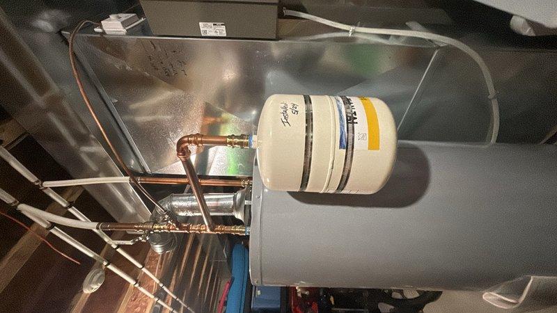 Completed preventive plumbing maintenance inspection on residential water heater and associated piping system located in basement. Unit is under 10 years old and showing normal operational condition. Inspected water heater tank, copper supply lines, brass fittings, and connection points for signs of corrosion, leaks, or mineral buildup. Observed minor mineral deposits and crystalline accumulation at pipe connections, consistent with typical water chemistry in the area. All mounting brackets and support straps verified secure. Copper piping and joints examined for integrity with no active leaks detected. System pressure and safety components functioning within normal parameters.