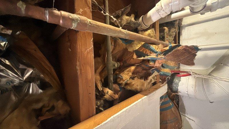 Replaced exterior hose bibb with new frost-free faucet assembly. Accessed supply lines through crawl space, installed new copper piping with shut-off valve, and secured connections per code requirements.