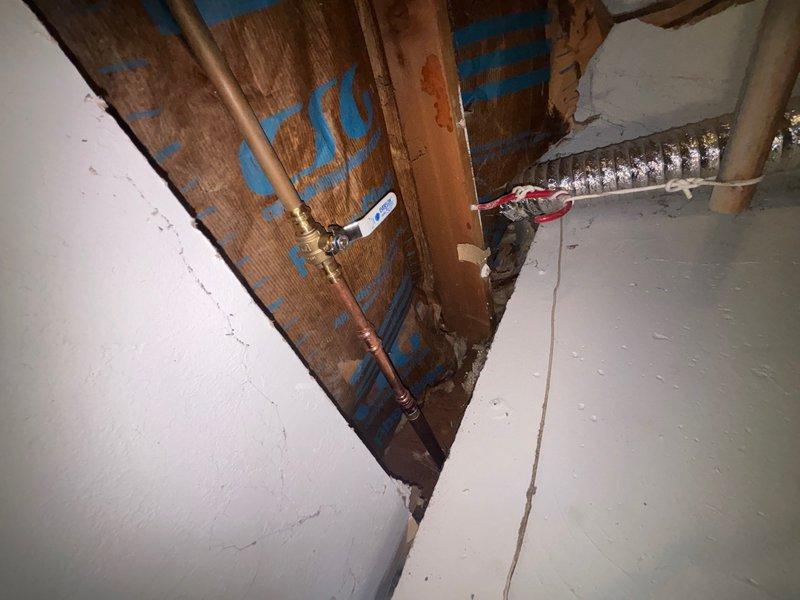 Replaced exterior hose bibb with new frost-free faucet assembly. Accessed supply lines through crawl space, installed new copper piping with shut-off valve, and secured connections per code requirements.