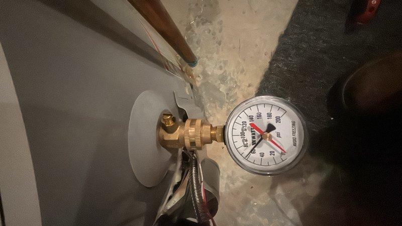 Responded to plumbing maintenance request to inspect wastewater line for possible leak. Conducted thorough visual inspection of accessible plumbing system in utility area, examining overhead PVC drainage lines, copper supply lines, and associated fittings for signs of moisture, corrosion, or active leaks. Performed pressure test on water system using calibrated gauge at wall-mounted connection point to verify system integrity and identify any pressure anomalies that could indicate hidden leaks. All visible plumbing connections, joints, and pipe runs were examined with no evidence of active leakage detected at time of inspection. Documentation photos captured for record.