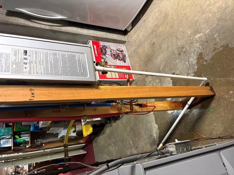 Successfully installed a Rinnai RX199 condensing tankless water heater with 11.0 GPM capacity and 96% efficiency rating in garage location. Removed and properly disposed of existing conventional water heater, capping all abandoned gas lines and venting as required by code.

Installation included running approximately 15 feet of 2-inch PVC piping for both combustion air intake and exhaust venting, terminated with appropriate exterior venting configuration for optimal unit performance. Installed hot and cold water supply lines using Aquapex tubing, ensuring proper connections to existing plumbing system. Gas supply line was extended using black iron pipe with required fittings including tee and elbows, complete with code-compliant dirt leg and emergency shut-off valve for safety.

Routed condensate drainage line to existing floor drain with proper air gap and vent installation below unit to prevent backflow. Verified pre-installation requirement of dedicated 110-volt electrical outlet wa