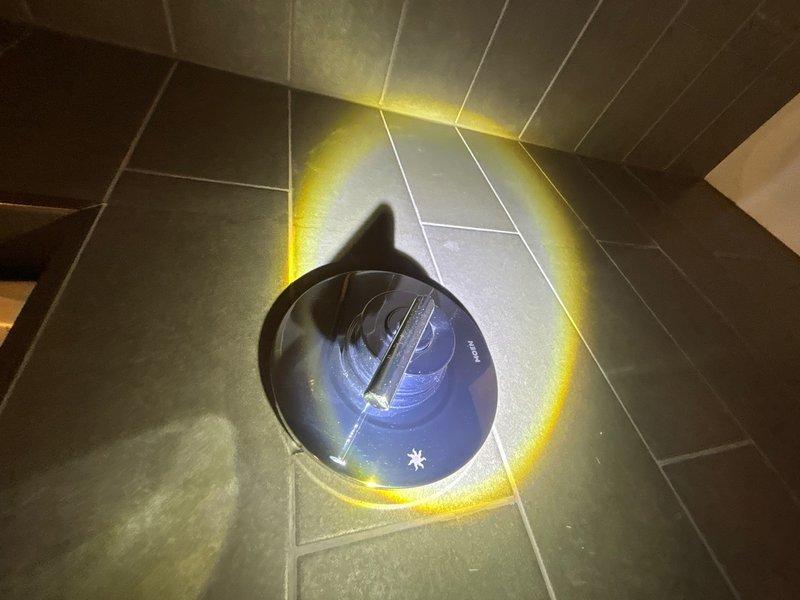 Performed plumbing maintenance inspection in crawl space and main living area. Assessed vapor barrier condition and moisture levels in crawl space foundation area using digital measurement equipment. Inspected floor surfaces and documented conditions for maintenance records. All areas evaluated and photographed for service documentation.