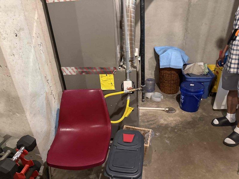 Completed on-site assessment for water softener installation in residential basement location with no existing water treatment system currently in place. Evaluated utility room area and confirmed available space for equipment placement near existing plumbing infrastructure and HVAC systems. Documented site conditions including concrete foundation walls, floor space, and proximity to main water supply lines and electrical service for future installation planning.