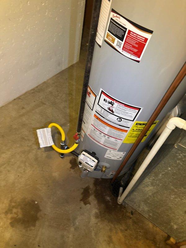 Successfully installed a 50-gallon natural gas water heater in the basement mechanical room. The installation included connecting copper supply lines with brass fittings and shutoff valves for both hot and cold water connections, as well as installing a flexible yellow gas line with proper safety shutoff valve. All plumbing connections were completed to code specifications, and the unit was positioned against the concrete block wall with appropriate clearances for ventilation and service access.