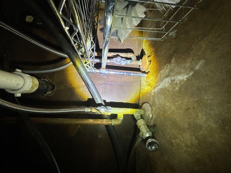# Plumbing Maintenance Summary

Performed routine plumbing maintenance inspection in crawl space and mechanical room. Inspected exposed water supply lines with flexible braided metal connectors and brass fittings for proper connections and potential leaks. Examined PVC drainage piping and verified secure mounting of all plumbing components. Assessed condition of mechanical equipment connections and confirmed proper installation of supply lines near HVAC ductwork in crawl space area. All plumbing systems inspected and found to be functioning properly with no immediate repairs required. Documented conditions with photographs for maintenance records.