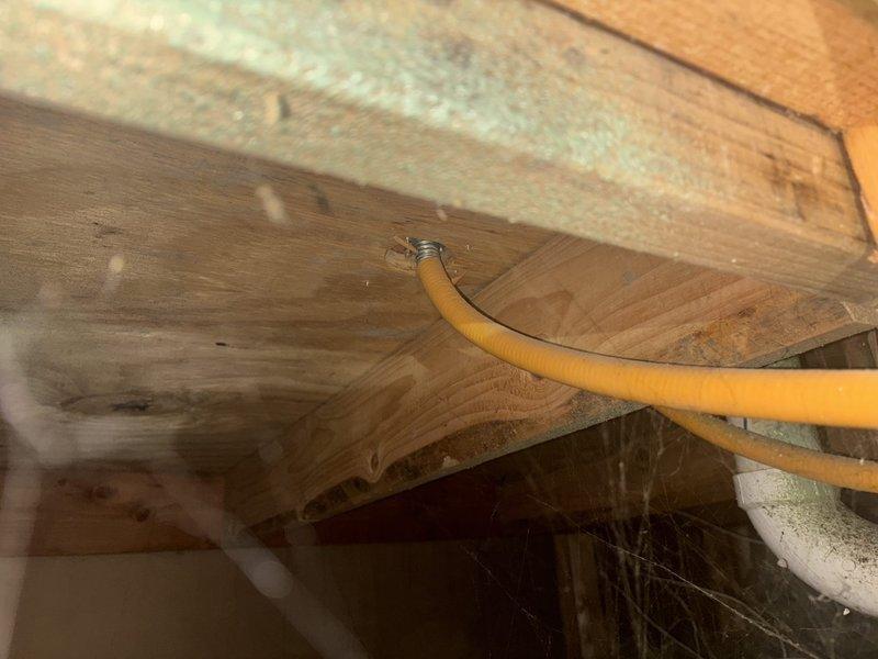 Capped gas line in kitchen per customer request. Removed and replaced existing garbage disposal with customer-supplied unit, ensuring proper electrical connections and drain line installation. Installed customer-supplied reverse osmosis water purification system under sink with dedicated faucet, completing all necessary supply line connections and drain saddle valve installation. Routed flexible gas line through attic space and properly secured with approved fasteners. Verified all connections for leaks and confirmed proper operation of all installed fixtures.