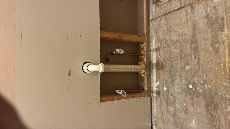 Conducted comprehensive assessment of existing plumbing infrastructure in two bathrooms to provide estimate for relocating waterlines. Inspection revealed exposed framing and PVC supply lines requiring rerouting through wall cavities and floor joists. Documented existing pipe locations, structural considerations, and necessary demolition points to facilitate waterline relocation during renovation project.