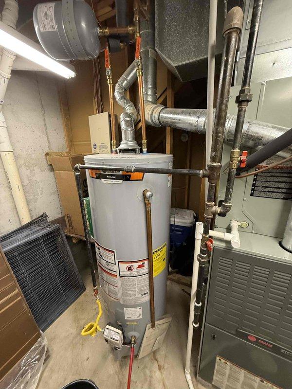 Performed routine maintenance flush on residential tanked water heater located in basement mechanical room. Drained sediment buildup from tank bottom through drain valve using hose directed to floor drain, cleared accumulated mineral deposits to restore heating efficiency and extend unit lifespan. Water heater and surrounding HVAC equipment confirmed in proper working condition upon completion.