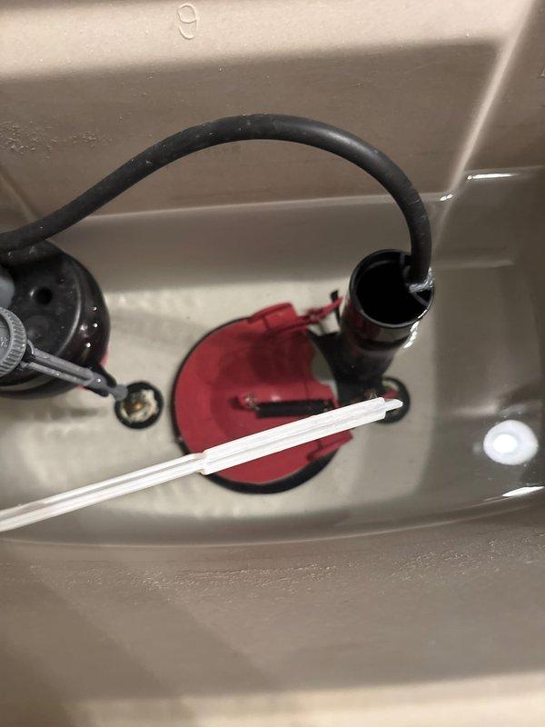 Replaced worn and warped toilet flapper in upstairs hallway bathroom to restore proper seal and prevent continuous water leakage from tank to bowl. Repaired leak under bathroom sink. The deteriorated flapper was causing unnecessary water waste and potential increased water consumption.