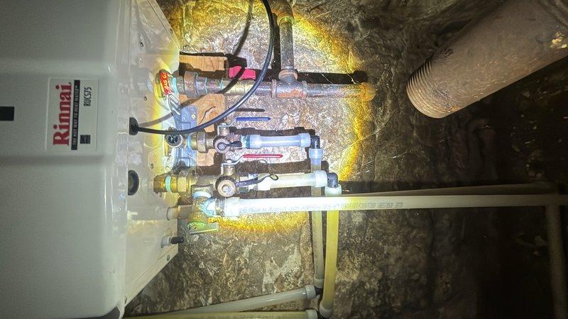 Completed preventive plumbing maintenance on residential water heating system including Rinnai tankless unit. Inspected all visible piping, valves, pressure gauges, and connections in mechanical room. Verified proper operation of gas line valves, manifold assemblies, and pressure regulation equipment. All components found to be functioning within normal parameters with no leaks detected.