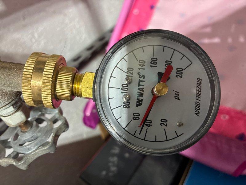 Conducted comprehensive assessment of 16-year-old water heater system in basement to provide replacement estimate. Inspected existing installation including pressure relief valve assembly, temperature and pressure gauge readings, supply line connections, and associated copper and PVC plumbing infrastructure. Documented current system configuration, valve conditions, and mounting arrangements to determine scope of replacement work and ensure proper sizing for new unit installation.