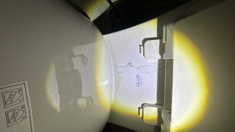 Responded to service call for toilet not filling properly in hallway bathroom nearest to kitchen. Upon inspection, diagnosed issue with fill valve mechanism preventing proper water flow into tank. Repaired fill valve assembly to restore normal toilet operation and verified proper filling cycle and water level upon completion.
