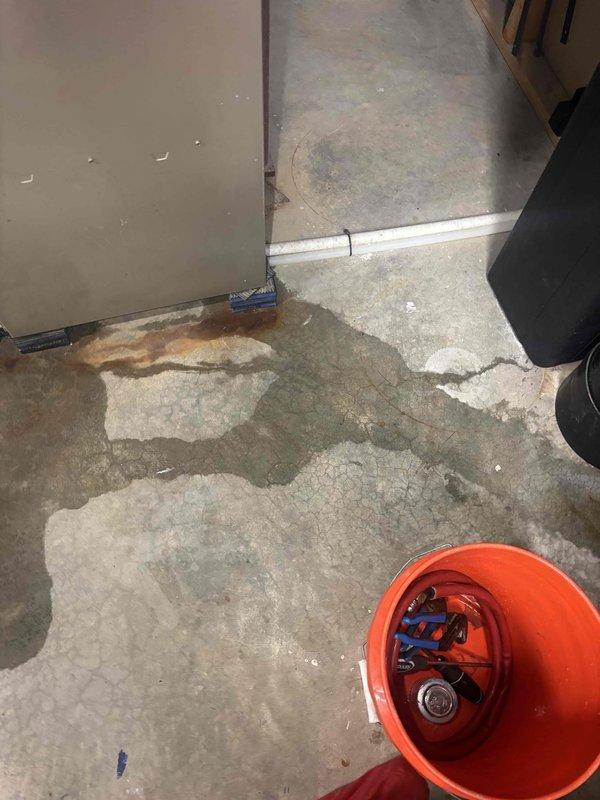 Responded to callback for O-ring discharge and leaking issue. Upon arrival, inspected the affected area and identified active water infiltration on concrete floor with visible moisture staining and discoloration. Replaced faulty O-ring seal that was causing the discharge and leak. Verified proper seating and compression of new O-ring to ensure watertight seal. Tested system operation and confirmed no further leaking or discharge present.