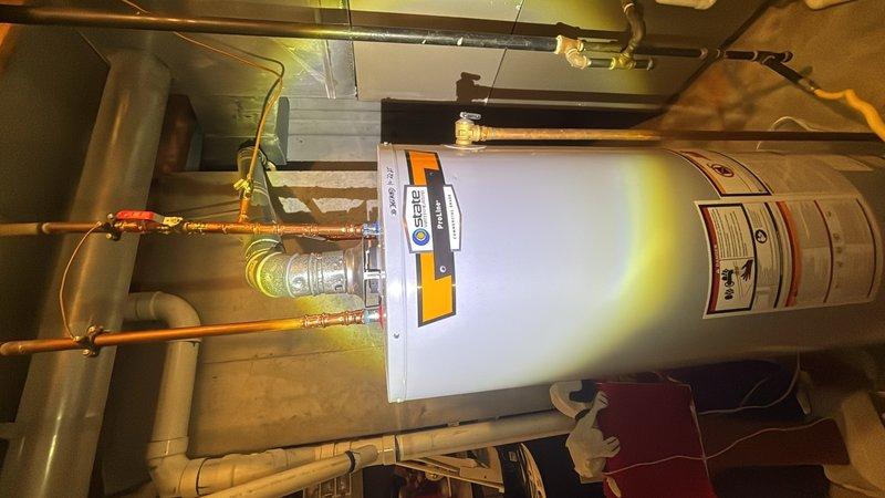 Completed plumbing maintenance inspection of residential water heater and toilet systems. Inspected basement mechanical room equipment including water heater installation, copper supply lines, and associated piping connections, verifying proper operation and documenting current condition. Performed toilet flush valve inspection and documented interior bowl components for maintenance records.