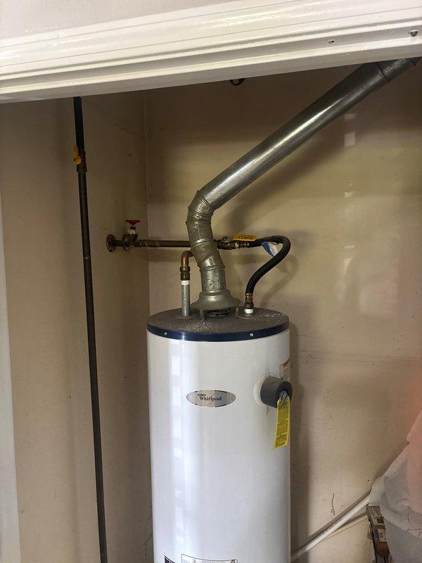 Responded to service call for Whirlpool tanked water heater with pilot light that would not remain lit. Upon inspection of unit located in utility closet, performed diagnostic testing of thermocouple and gas control valve assembly. Cleaned pilot assembly, verified proper gas pressure at manifold using gauge, and tested safety shutoff mechanisms. Adjusted pilot flame and confirmed thermocouple was generating adequate millivoltage for gas valve operation. Cycled unit multiple times to ensure pilot remained lit and burner ignited properly. Water heater restored to normal operating condition with pilot light functioning reliably.